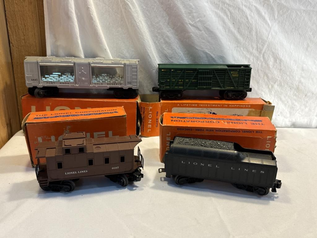 4 Lionel Trains: 4 Lionel Trains ~ No. 6017~1 Caboose, 6445 Box car , 1130T Tender and 3370 Animated Sheriff and outlaw car
