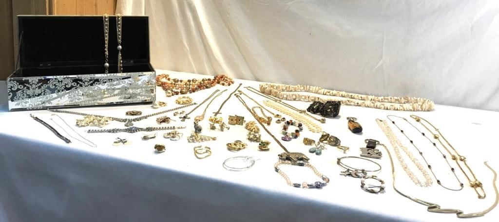 Mirrored Jewelry box w/ Jewelry: Avon, Sterling, Mother of Pearl, Kramer, Robert Lee Morris and Costume Jewelry/ Rings, Pins, Necklaces, Bracelets, Cuff Links, Earrings Both Clip on and Pierced, Round Sterling and Mother of Pearl Ear