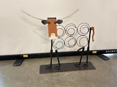 Metal Cow Sculpture Designed to hold Wine Bottles