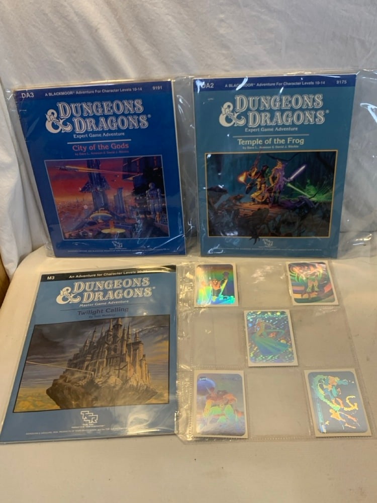 3 1980’s Dungeons & Dragons Game Guides and 1990 Marvel Comics Hologram Trading Cards: 1980’s Dungeons & Dragons Game Guides (3) and 1990 Marvel Comics Hologram Trading Cards (5)