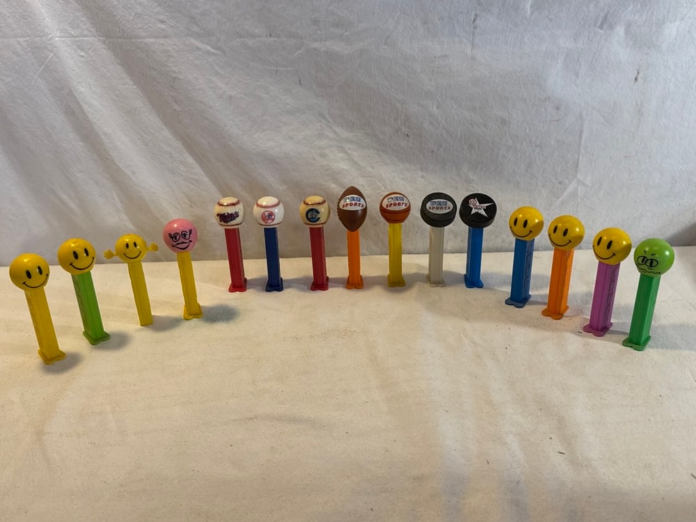 Vtg. Pez Dispensers: 15 Vtg. Pez Dispensers including Sports Collection (Yankees,Twins, Metro Stars) and Smiley/ Funky Face Collection