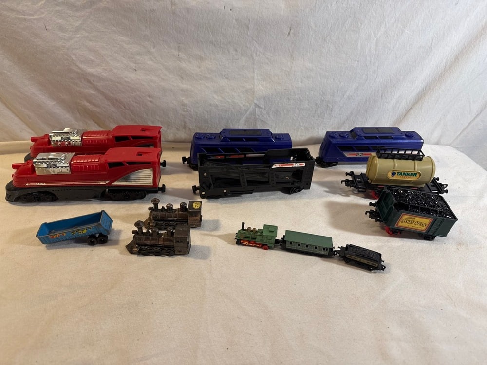 Vtg Trains Lot: Vtg Trains Lot including 2- Hot Wheels Express 454 Locomotive Engines, 2- No. Passenger Cars, No. 15 Car Carrier, Goldlok Tanker & Coal Car, 2 Brass Pencil Sharpeners, 1989 Soma pull Back Motion Train