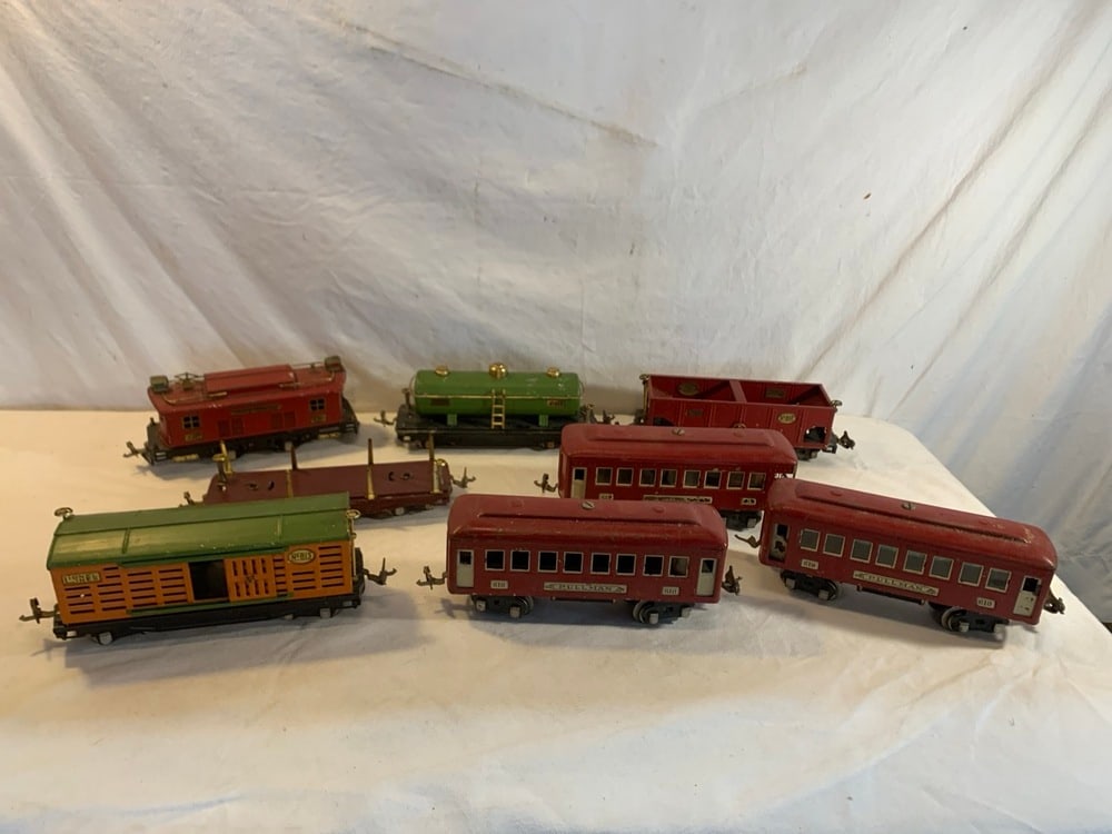 Vtg. Lionel Pre-War Tin Plate Train Cars: Vtg. Lionel Pre-War Tin Plate Train Cars including no. 813 Stock/cattle Car, 2 Pullman 610 Passenger Cars, Pullman 612 Passenger car, no. 815 Tank, model 450 Macy’s Special Passenger, No. 816