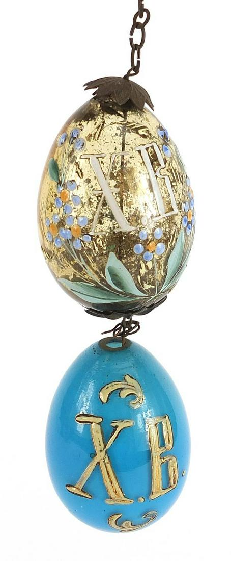 Very rare Russian Antique Glass Easter Eggs by Maltsev factory: Maltsev, pair of Imperial Russian glass Easter eggs with enamelled decoration inscribed Christ has Risen, the largest 7cm high