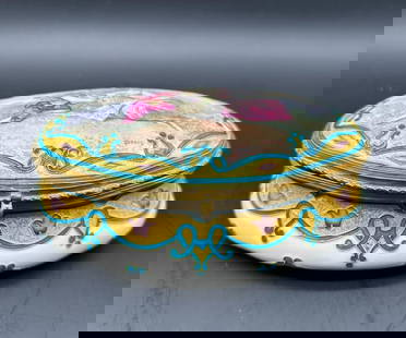 Sevres casket box painted with courting couple,signed.: Beautiful oval dressing table casket, painted on the cover with a courting couple, the cover and box each surrounded by a blue enamel strapwork border enclosing purple bellflowers and diamonds reserve