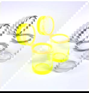 A Pair of Antique Uranium Glass Cylindrical Boxes: Uranium glass is glass which has had uranium, usually in oxide diuranate form, added to a glass mix before melting for coloration.The normal colour of uranium glass ranges from yellow to green dependi