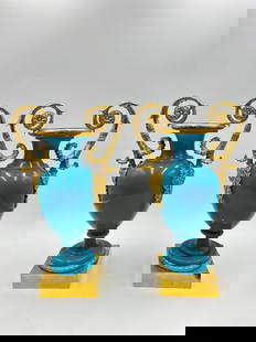 Extremely Rare Charles X Pair of early French Blue  Opaline and Ormolu vases: A pair of turquoise blue opaline baluster vases adorned with a fine chased and gilt bronze frame with two foliate handles with masks. Height : 33cmWidth: 19cmDate:Charles XCondition: PerfectProvenance