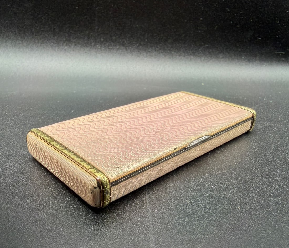 FABERGE ANTIQUE JEWELLED ENAMEL AND GOLD MOUNTED CIGARETTE CASE, August Hollming: Exclusive FABERGE silver gold mounted pink guilloche enamel,rose cut diamonds.Measures: 8,5/4,5cmCondition: Overall good,chip on the guilloche please refer to the photos.Marks: Faberge, A.H for August