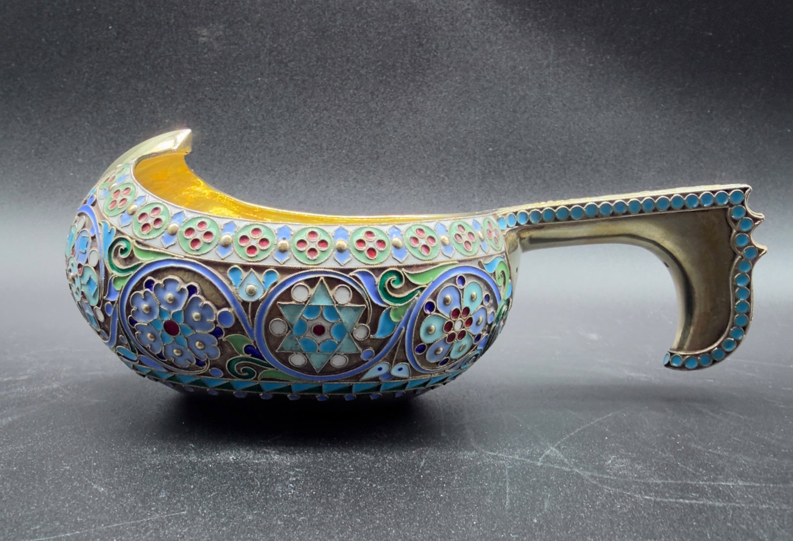 Ovchinnikov Russian parcel gilt cloisonné enamel large Kovsh with stars of David,Christie's: Very unusual large enamel Kovsh in beautiful pastel colours MOSCOW 1908-1917 Marks: Ovchinnikov signature in Cyrillic and Imperial Warrant, 84 standard, the base engraved Moscou 1911 Weight: 310grCond