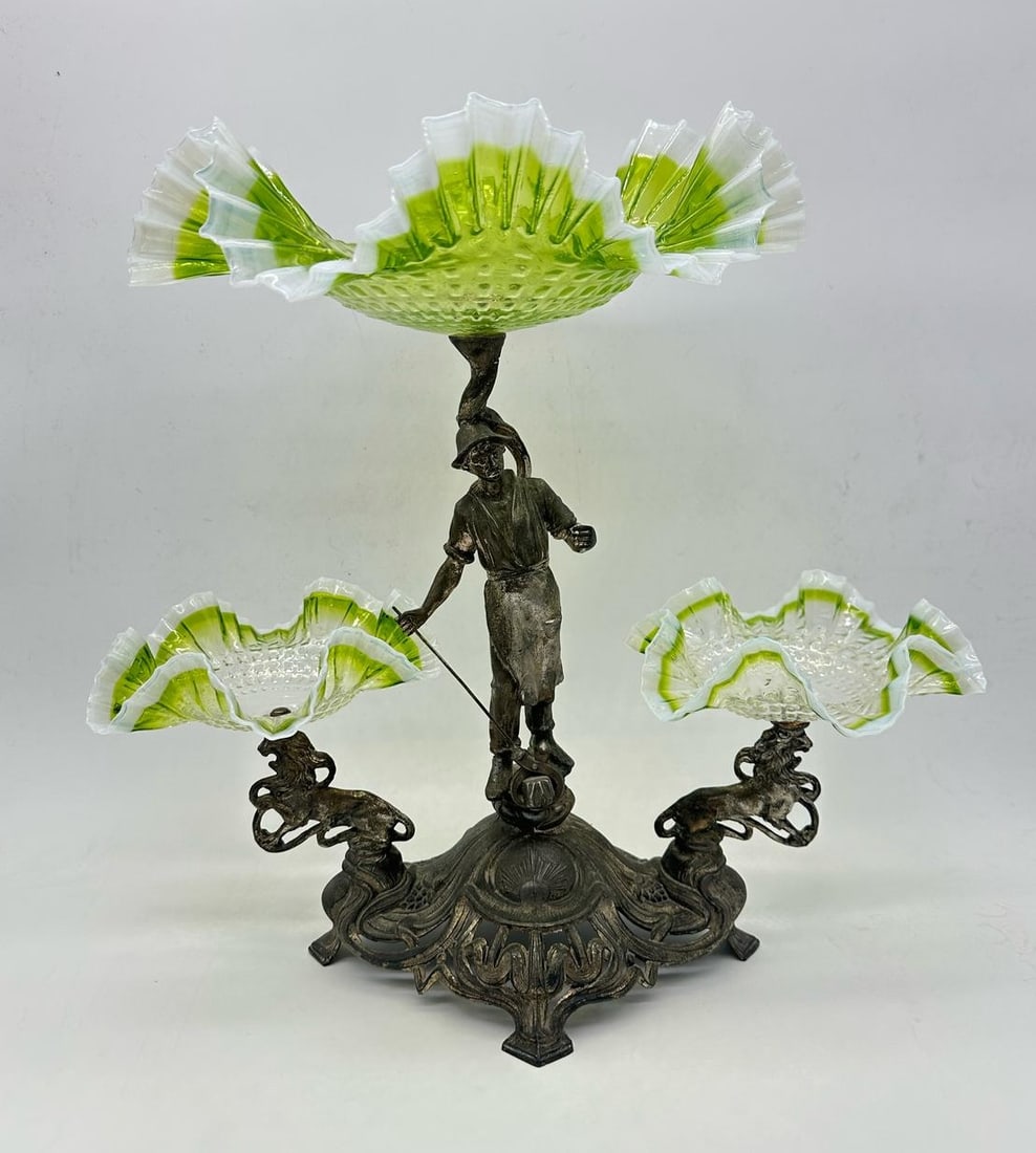 Art Nouveau centerpiece with 3 glass opalescent bowls: Beginning of 20 century Art Nouveau,Liberty,Jugendstil centrepiece for biscuits,nuts,raisins . Measures:43 x 45 x 30 cmWeight:over 3kgDescription:Cast Metal oval base with relief ornament ;central bow