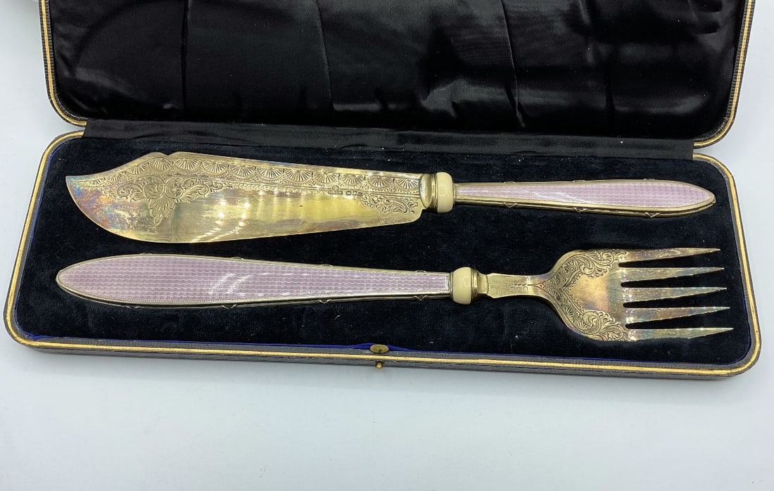 Faberge Guilloche Enamelled Silver Fish Service Accompanied by a Case: Guilloche enamelled silver fish service by Faberge, accompanied by a fitted leather case.Moscow City Hall Mark (84), HW- Henrik Wingstrom32.4 cm (the longest, fish knife)325 grams (10.4492 troy ounces