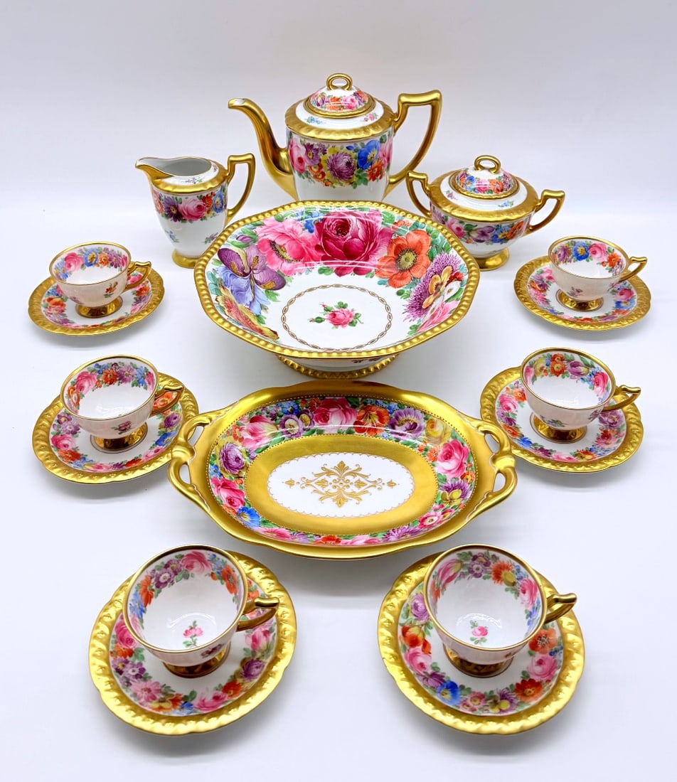 Dresden Porcelain Coffee Service For 6 Persons: Richly decorated with gold and hand painted flowers.Set consists of 6 cups, 6 saucers, milk pot, sugar pot, coffee pot, cake plater and fruit bowl.All pieces are in perfect condition.Coffee service fo