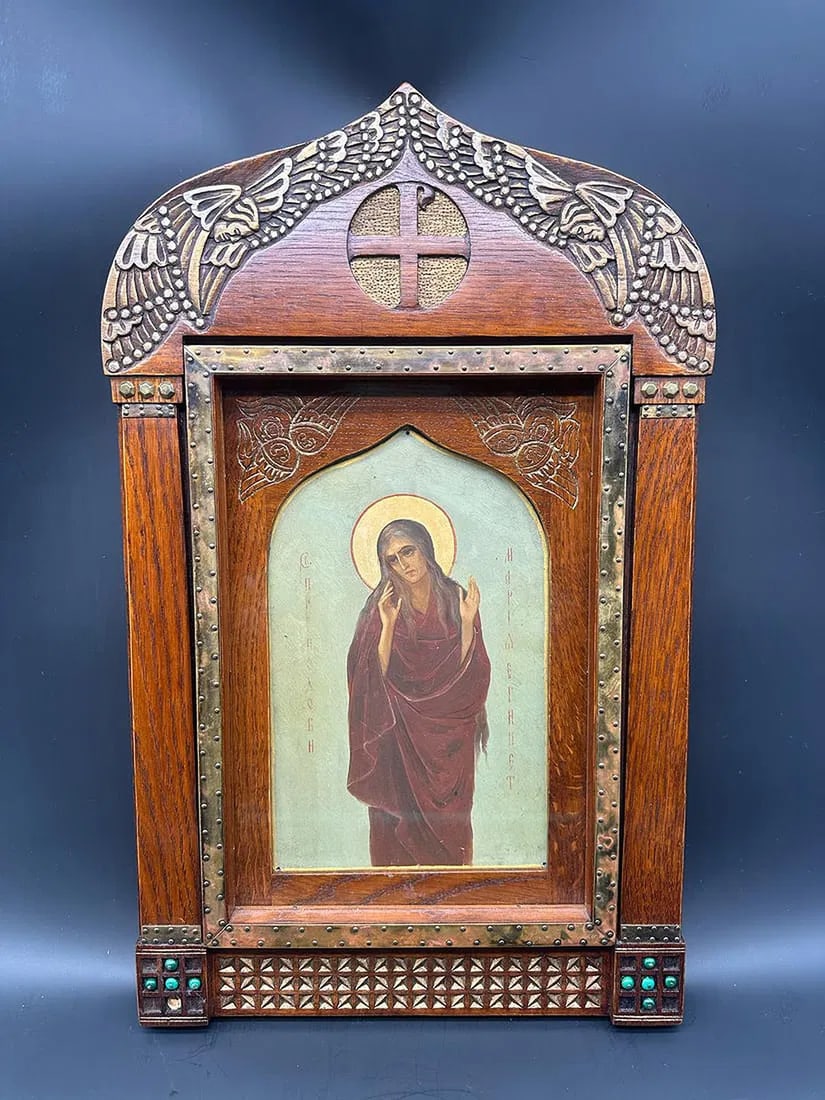 Russian Icon from the Talashkino School. Mary of Egypt. Oil on Panel: School of Talashkino.Mary of EgyptOil on panel in a protective framing (kiot) in carved wood ornamented with appliqués in chased brass and cabochons.H 51 cm, L 32 cmVery good condition.Provenance: Pr