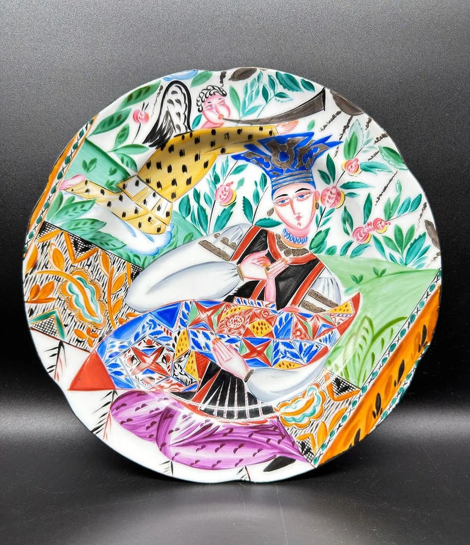 Russian State Porcelain Manufactory, Petrograd. Plate of Alexandra Shchekatikhina-Pototskaya,: Alexandra SHCHEKATIKHINA-POTOTSKAYA (1892–1967) and STATE PORCELAIN MANUFACTORY, Petrograd, painted by M. P. KIRILLOVAMotherhood. Circular plate in porcelain with contoured border, with polychrome d