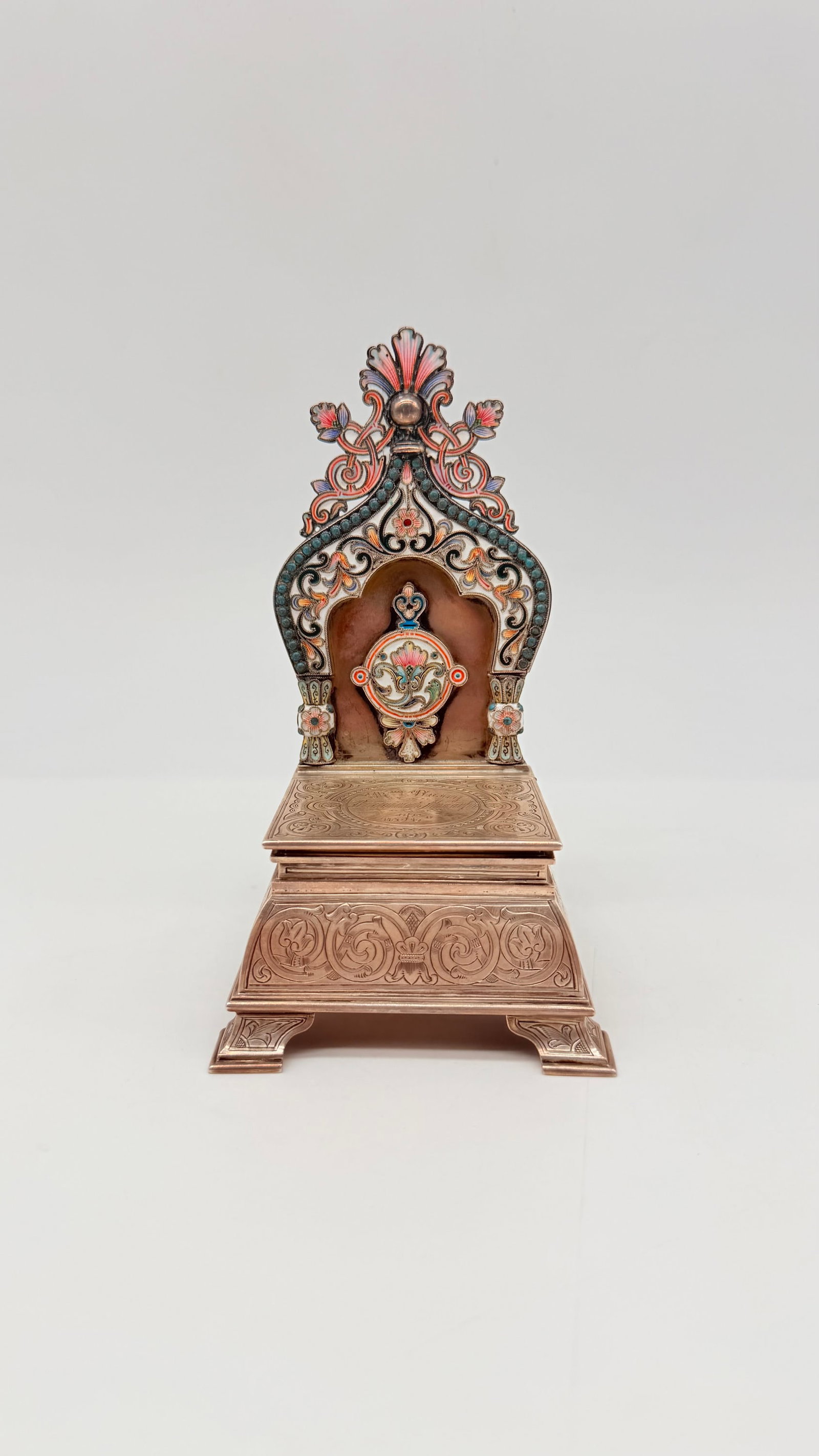 Orest Kurlyukov (1855–1916) | A Russian Silver and Cloisonné Enamel Salt Throne, Moscow, 1899: "Orest Fedorovitch KURLYUKOV (1845,1916).Salt throne (or throne-shaped salt cellar) in partly gilt silver with cloisonné and champlevé enamel decoration. In the Neo-Russian style, it features rich p