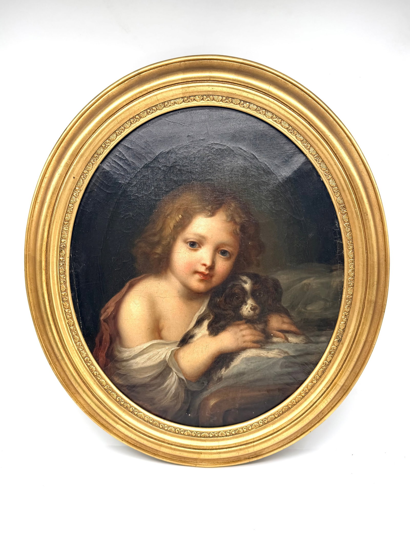 Russian School, 19th Century, in the Manner of Karl Bryullov — Portrait of a Child with a Dog,: RUSSIAN SCHOOL, 19TH CENTURY, IN THE MANNER OF KARL BRYULLOV (1799–1852)Portrait of a child with a Small DogOil on oval canvas.H_50 cm W_43 cmRelined; old restorations and customary wear.Provenance:
