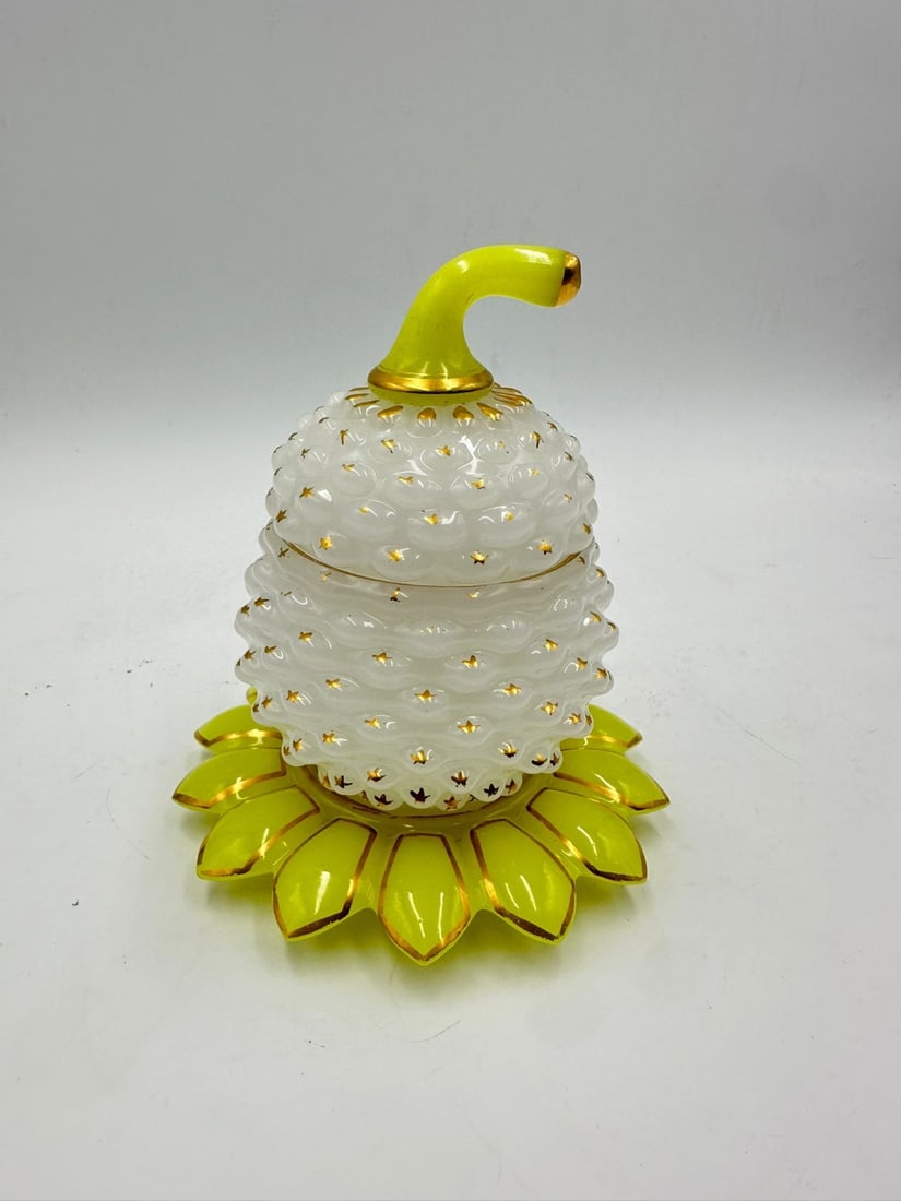 BACCARAT TWO-TONE 'PÂTE DE RIZ' AND YELLOW URANIUM OPALINE GLASS PINEAPPLE-FORM COVERED BOX, CIRCA: covered box or sugar bowl crafted in translucent, semi-opaque white opaline glass using the rare pâte de riz (rice paste) technique, press-molded in relief in the form of a textured pineapple. Each r