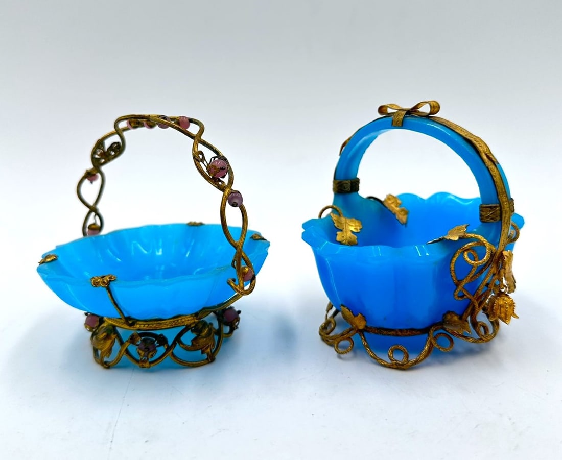 PAIR OF FRENCH TURQUOISE OPALINE GLASS BASKETS WITH GILT-BRONZE MOUNTS, NAPOLEON III PERIOD, CIRCA: Pair of small French turquoise-blue opaline glass baskets (corbeilles or vide-poches), featuring scalloped, ruffle-molded edges. Each piece is adorned with gilt-bronze (ormolu) foliate and floral wire