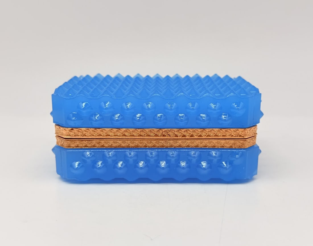 FRENCH AZURE BLUE OPALINE GLASS CASKET BOX WITH DIAMOND-POINT STUDDED MOTIF, 19TH CENTURY: A large rectangular hinged casket box in vibrant azure-blue opaline glass. The exterior is molded with relief-pointed studs ("diamond-point" or "hobnail" pattern) covering the lid and surrounding side