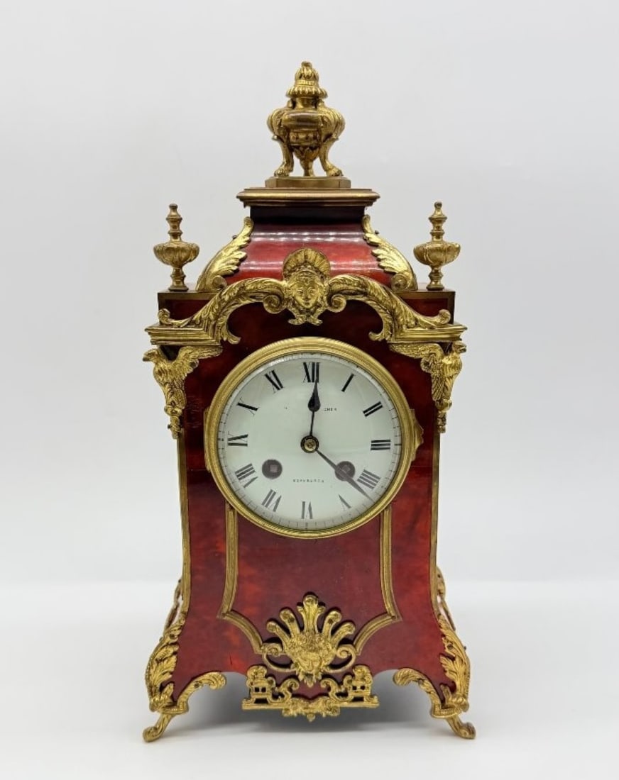 Hamilton & Inches / Vincenti & Cie A Louis XIV-style Table Clock In Red Tortoiseshell (or Boull: HAMILTON & INCHES / VINCENTI & CIEA Louis XIV-style table clock in red tortoiseshell (or Boulle-style marquetry) with gilded bronze fittings. The cream-coloured enamel dial with Roman numerals bears t