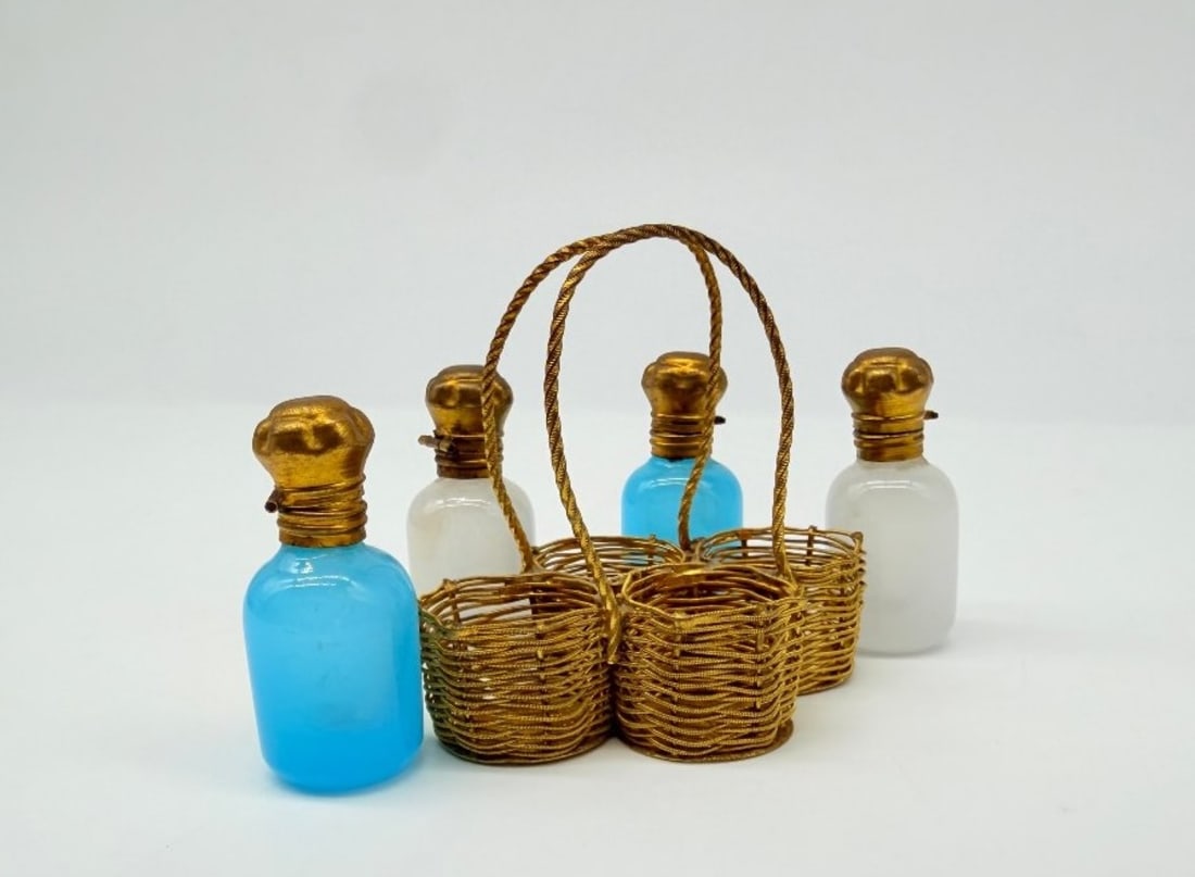 Napoleon III Miniature Travel Necessaire With Opaline Scent Bottles And Gilt Brass: A charming miniature travel set comprising four small perfume bottles (two in sky-blue opaline and two in white opaline) with cylindrical bodies. Each bottle is fitted with a mount and a hinged stoppe