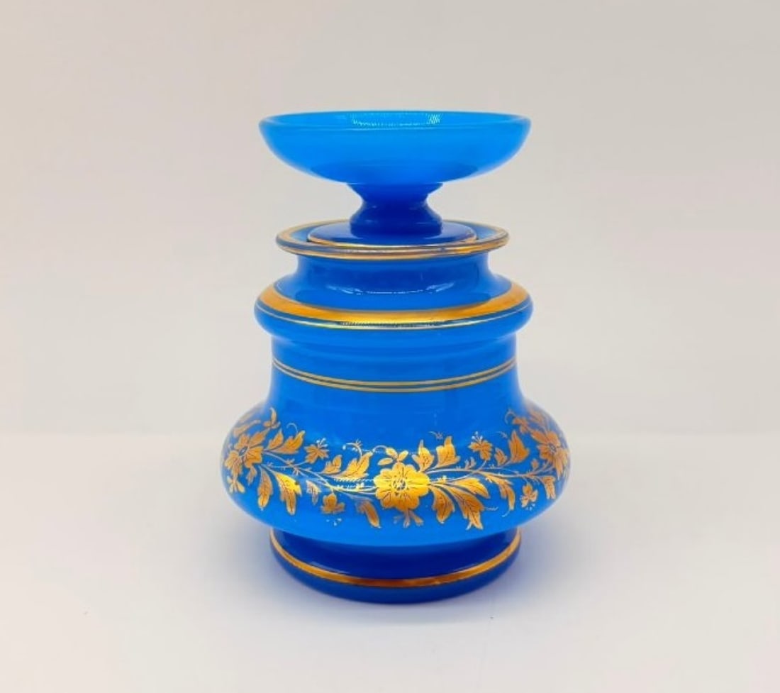 Turquoise Blue Opaline Sponge Pot With Gold Enamel Decoration, Circa 1850: Desk sponge pot with a turquoise-blue opaline lid, featuring a dynamic, tiered shape with a bulbous base. The body is adorned with a rich decoration of matt and glossy gold enamel depicting a continuo