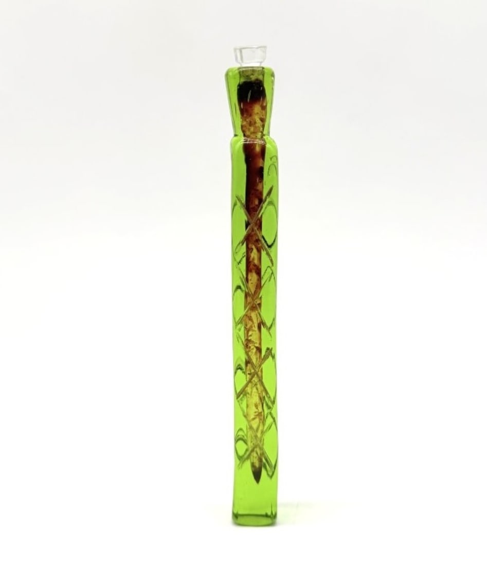 Green Engraved Glass Scent Flask With Cut Glass Stopper, Bohemia, 19th Century: A tubular scent flask (or perfume bottle) made of green-tinted Bohemian crystal, with a ground-engraved decoration featuring interlacing cross-hatch patterns forming a latticework and circular bands, 