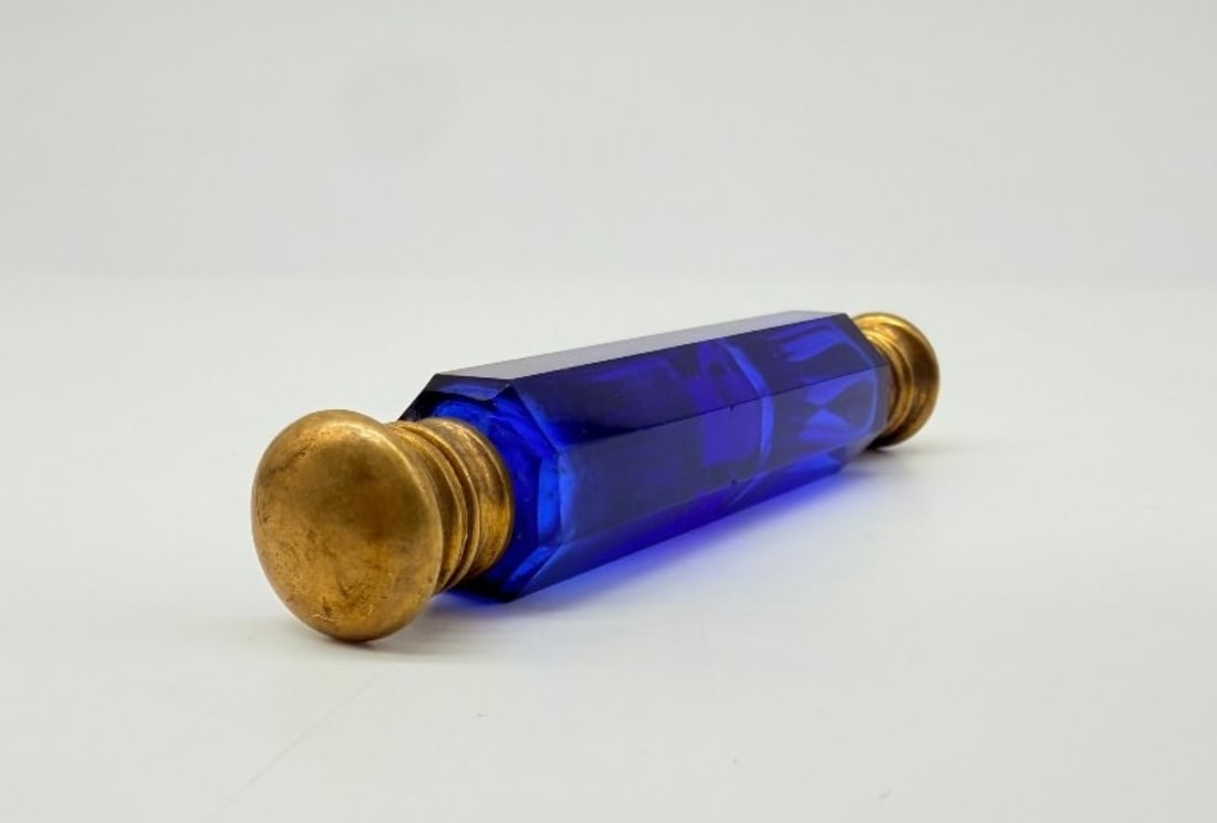Double Blue Cut Crystal Travelling Scent Bottle, France, 19th Century: Hexagonal-shaped double perfume bottle for a travel kit, made of cobalt-blue tinted crystal with faceted sides, fitted at each end with a hinged gold-plated metal mount.French craftsmanship. 19th cent