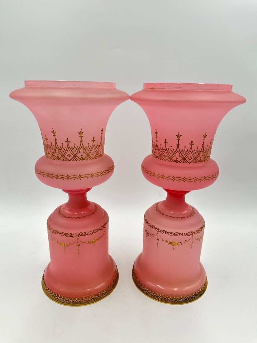 PAIR OF FRENCH PINK OPALINE GLASS MEDICI VASES WITH GILT DECORATION: A pair of French frosted pink opaline glass vases of Medici form, with flared rims and knopped pedestals, raised on domed bases finished with pierced brass filigree borders and circular metal footings