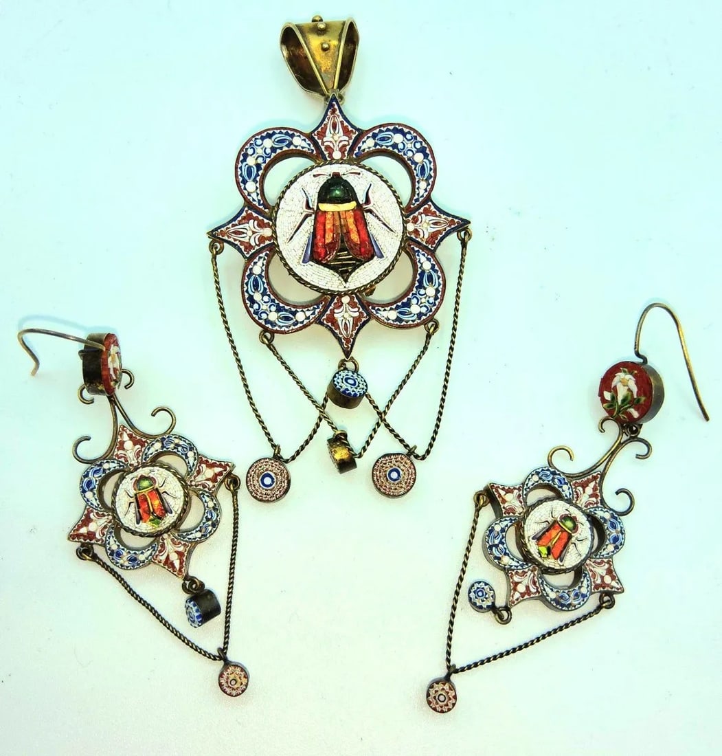 NAPOLEON III ITALIAN MICROMOSAIC PARURE, Italy, 19th Century (Grand Tour Souvenir): Italy, 19th Century (Grand Tour Souvenir)A 19th-century gilt-metal jewelry set comprising a large brooch-pendant and a pair of drop earrings decorated with spun glass micromosaic (tesserae). The centr