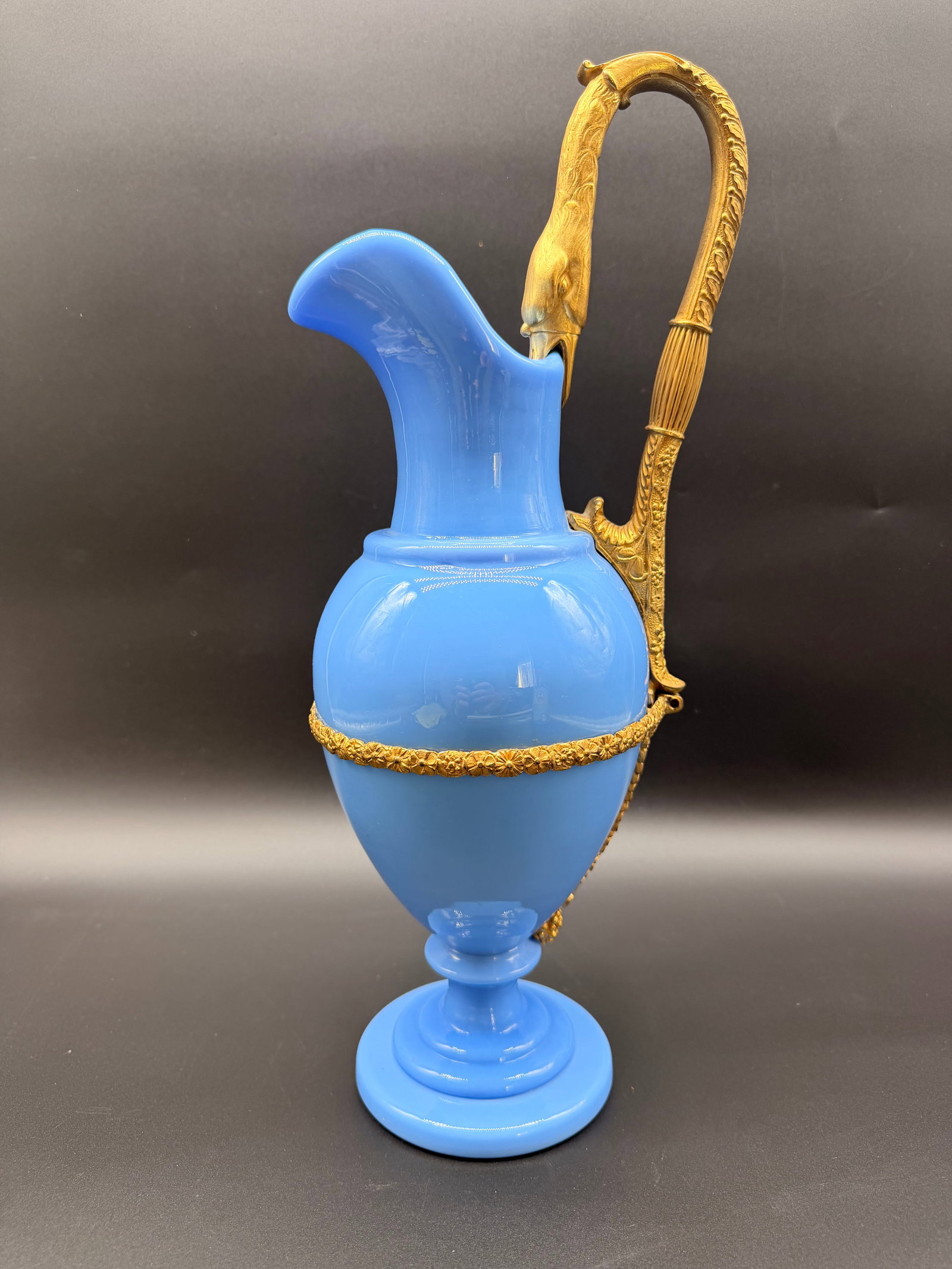 French Opaline Lavender colour Ewer decorated with swan shaped Dore Handle,period of Charles X: French lavender opaline glass ewer featuring an elongated flared rim, an ovoid body, and a stepped circular foot. Fitted with a finely chased gilt bronze (ormolu) handle shaped as a swan's head and ne