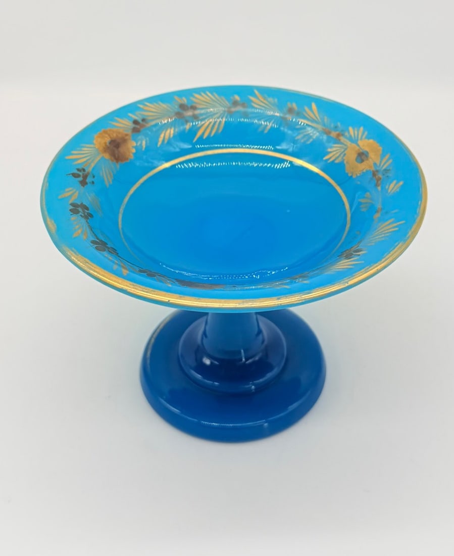 CHARLES X TURQUOISE OPALINE GLASS TAZZA BY JEAN-BAPTISTE DESVIGNES: Jean-Baptiste Desvignes (1786–1826)A French turquoise blue (bleu turquoise) opaline glass footed dish (tazza), hand-painted with a gilded and enameled floral frieze around the inner rim. The decorat