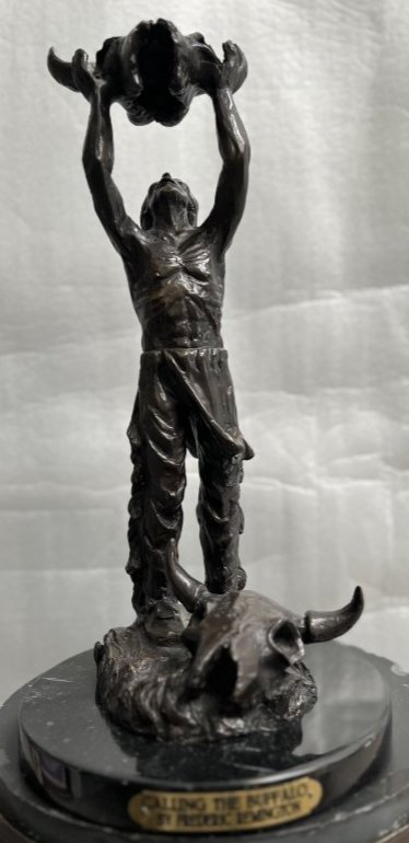 FREDERIC REMINGTON (AFTER) "CALLING THE BUFFALO" BRONZE WITH A MARBLE BASE 16" TALL: FREDERIC REMINGTON "CALLING THE BUFFALO" BRONZE WITH A MARBLE BASE 16" TALL VERY HEAVY IN HOUSSE SHIPPING $120
