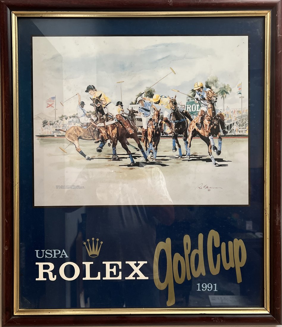 USPA ROLEX GOLD CUP POLO EVENT MARCH 1990 AT PALM BEACH POLO BY RAL SKIDMORE: This print depicts the USPA Rolex Gold Cup Polo Event held in March 1990 at Palm Beach Polo. The artist, RAL Skidmore, captures the excitement of the event with his realistic style. The print is signe