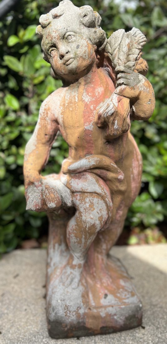 A WEATHERED CEMENT GARDEN STATUE (1 of 3)