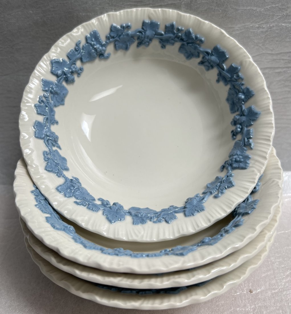 WEDGEWOOD EMBOSSED QUEENS WARE SET OF FOUR (4) BOWLES: Enhance your dinnerware collection with this beautiful set of four (4) Wedgewood embossed Queen's Ware dessert bowls. The floral pattern and round shape create a timeless look suitable for all occasio