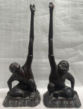 ART DECO PAIR OF CARVED WOOD, BOYS SITTING AND GRABING FOR THE STARS