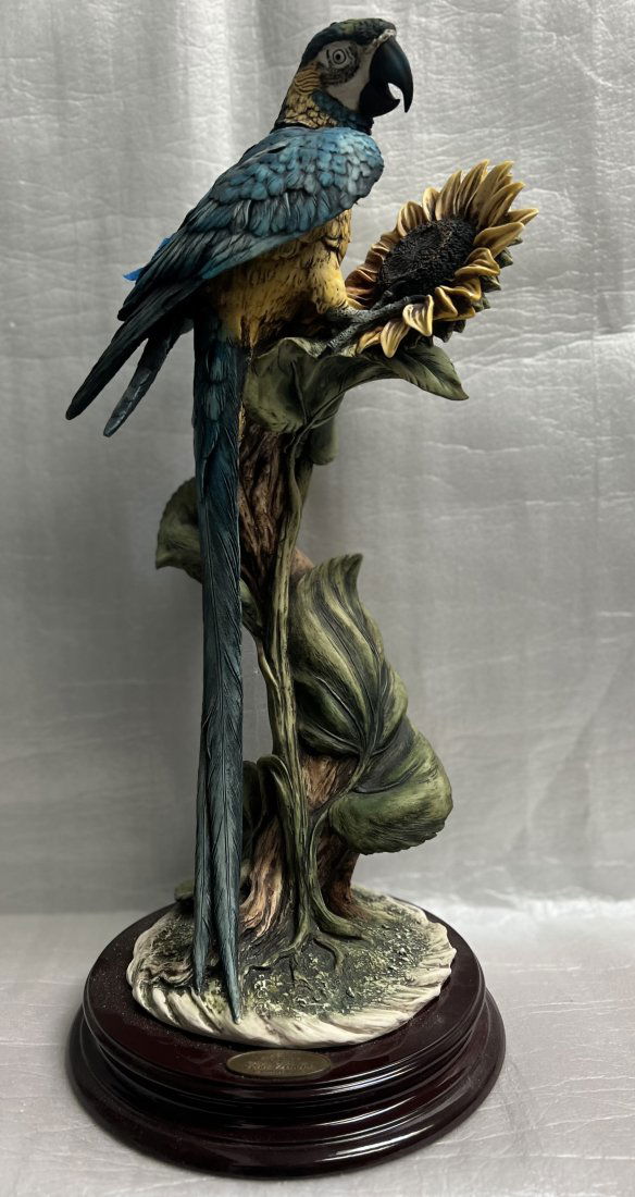 GIUSEPPE ARMANI BLUE PARROT & SUNFLOWER "BLUE WONDER" 24" T LIMITED EDITION NUMBERED: This beautiful figurine by Giuseppe Armani features a stunning blue parrot perched on a sunflower. It is a limited edition piece, numbered and crafted in Italy during the 1990s in the art deco style.