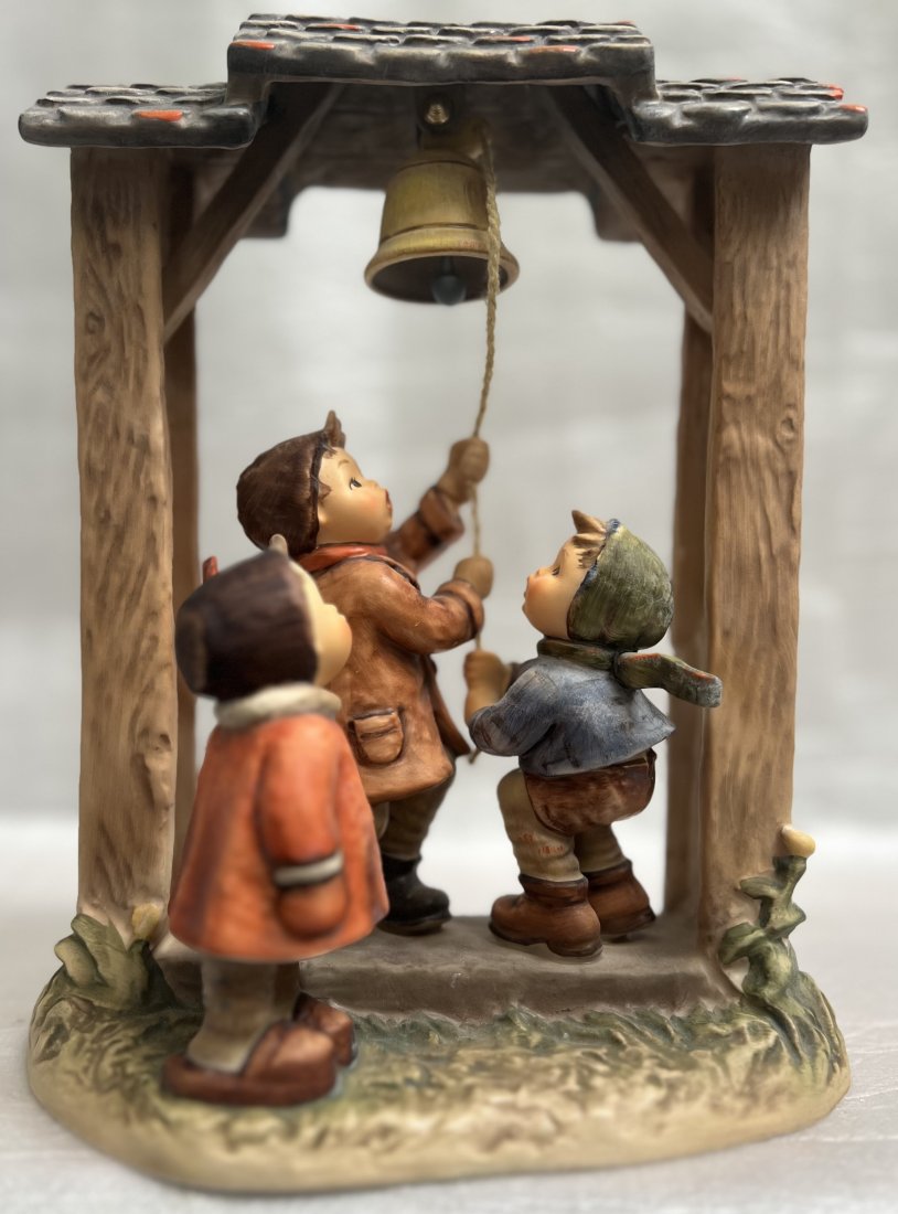 GOEBEL "LETS TELL THE WORLD " CERAMIC STATUE M.J.HUMMEL SERIES 11" T 8" W 5" D: This beautiful Goebel statue from the M.J. Hummel series is a must-have for any collector or lover of decorative figurines. With its charming design and intricate details, it is sure to be a conversat