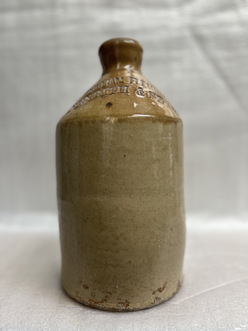 Stone Ware Jug Stamped " William Fleming" " Penrith & Shap": This stoneware jug is a true collectible, featuring the stamp of William Fleming and the locations Penrith & Shap. The medium-sized jug is made of high-quality stoneware, with a polished finish that a