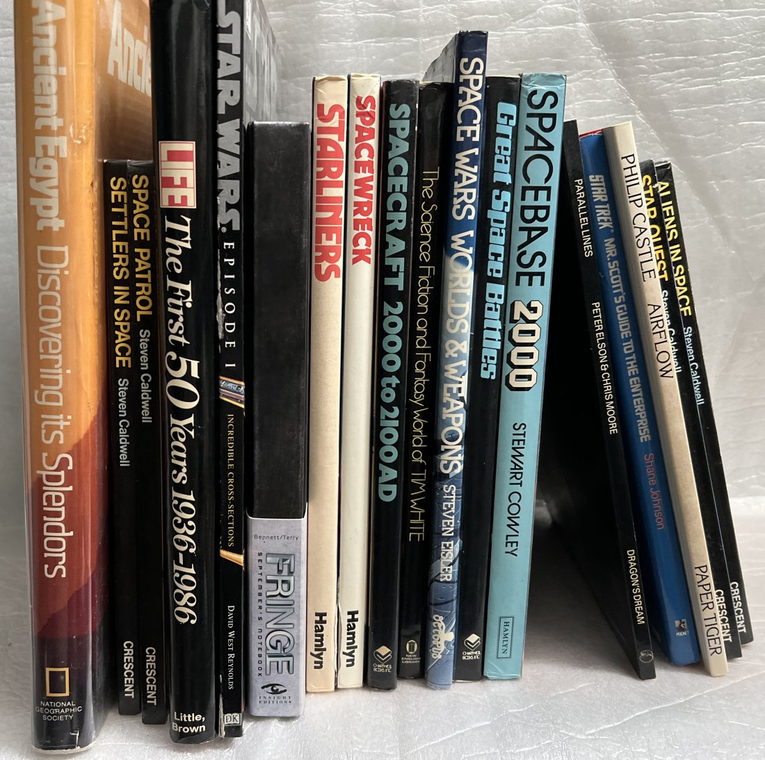 Collection of 18 Books, Space, Aliens, Egypt, Star Wars and more: This collection of 18 books includes a variety of unique and exciting topics. Explore the mysteries of space and encounter extraterrestrial beings in some of these titles. Others dive into the fascina
