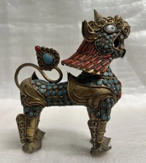 VINTAGE TIBETAN FOO DOG WITH TURQUISE & CORAL STONES: This exquisite figurine captures the essence of ancient Chinese culture with a beautifully crafted Tibetan Foo Dog. The intricately designed stone material comes in an alluring shade of blue and is ad