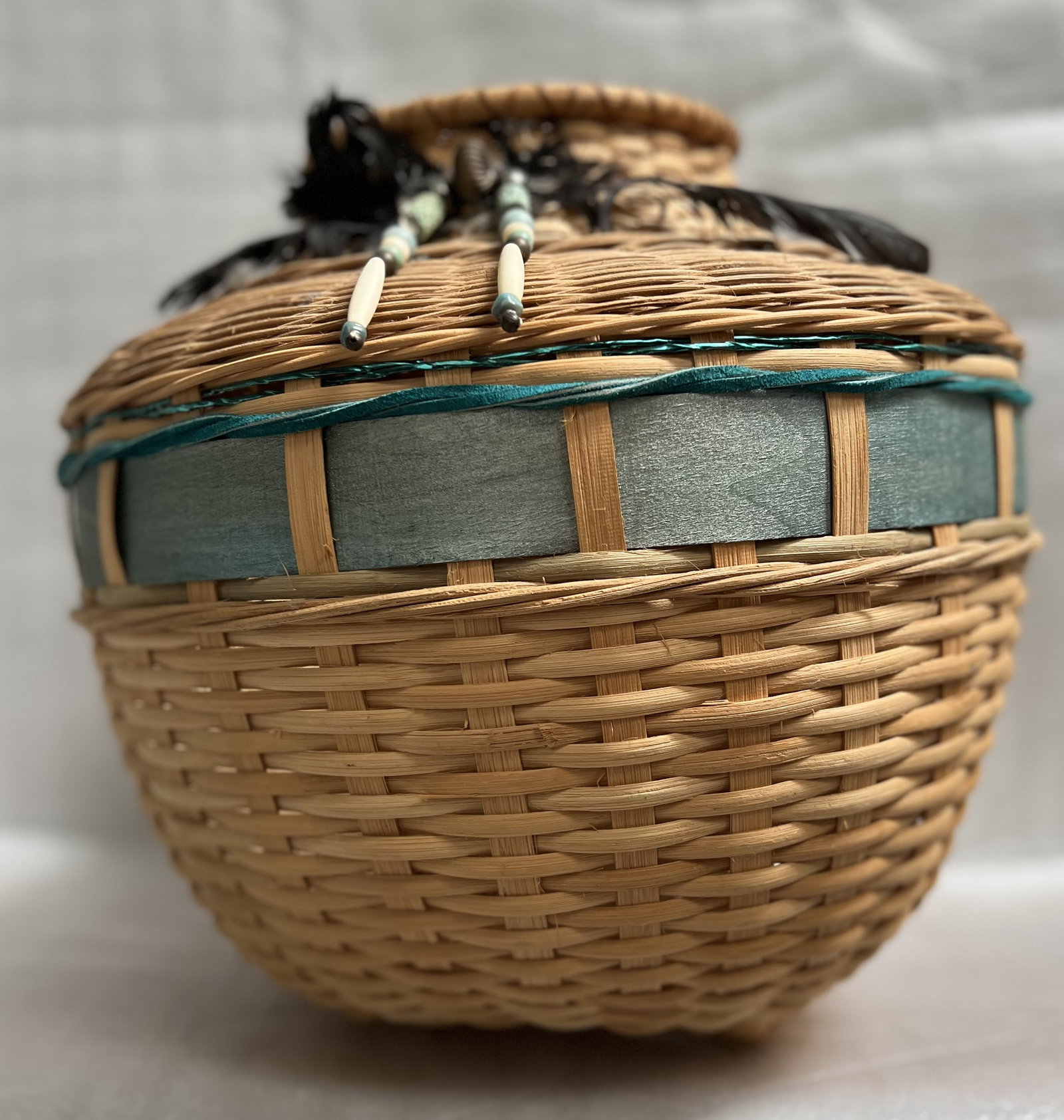 Native American Style Wicker Basket 13" T 15" W: This Native American style wicker basket is a beautiful piece that showcases the rich culture of the United States. Handmade with care, this basket is a unique addition to any collection. The basket m