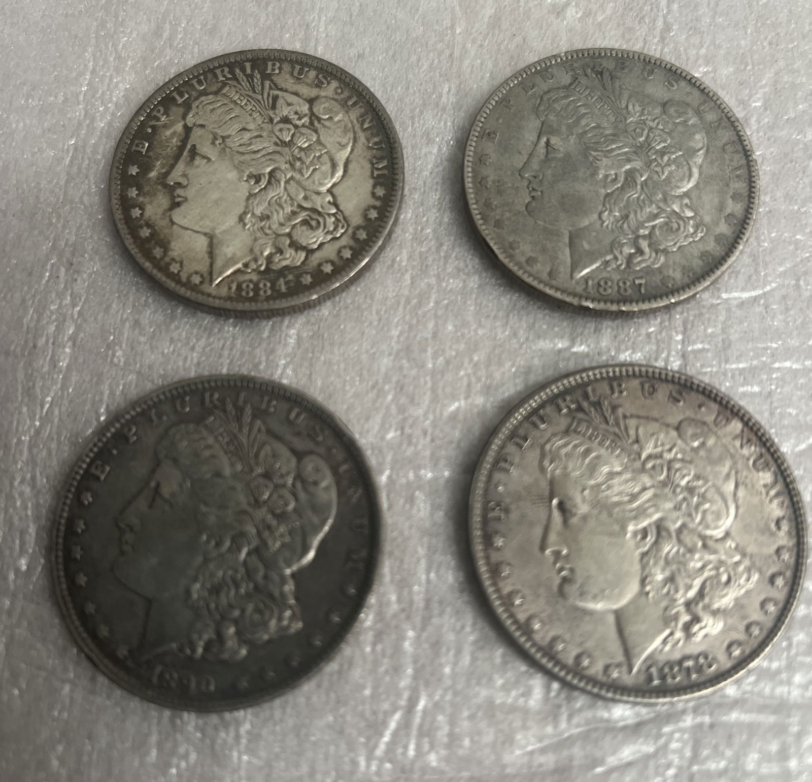 Lot of 4 Morgan Silver Dollars 1884 O , 1890 O, 1887 O and 1878 Lot of 4 Morgan Silver Dollars 1884 (1 of 2)