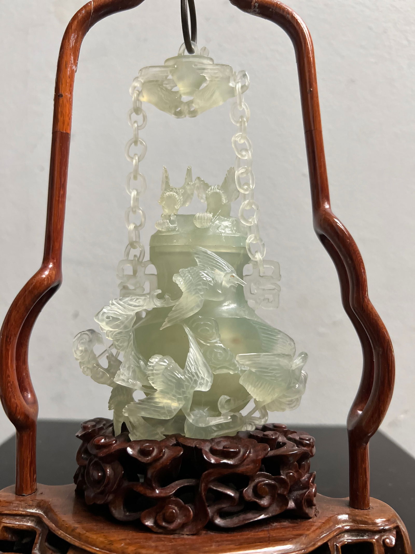 Stunning Chinese Hand Carved Jade Birds on a Carved Wood Base: This exquisite piece is a stunning example of Chinese artistry, with intricate hand carvings of jade birds perched on a carved wood base. The green jade and attention to detail make this a unique and