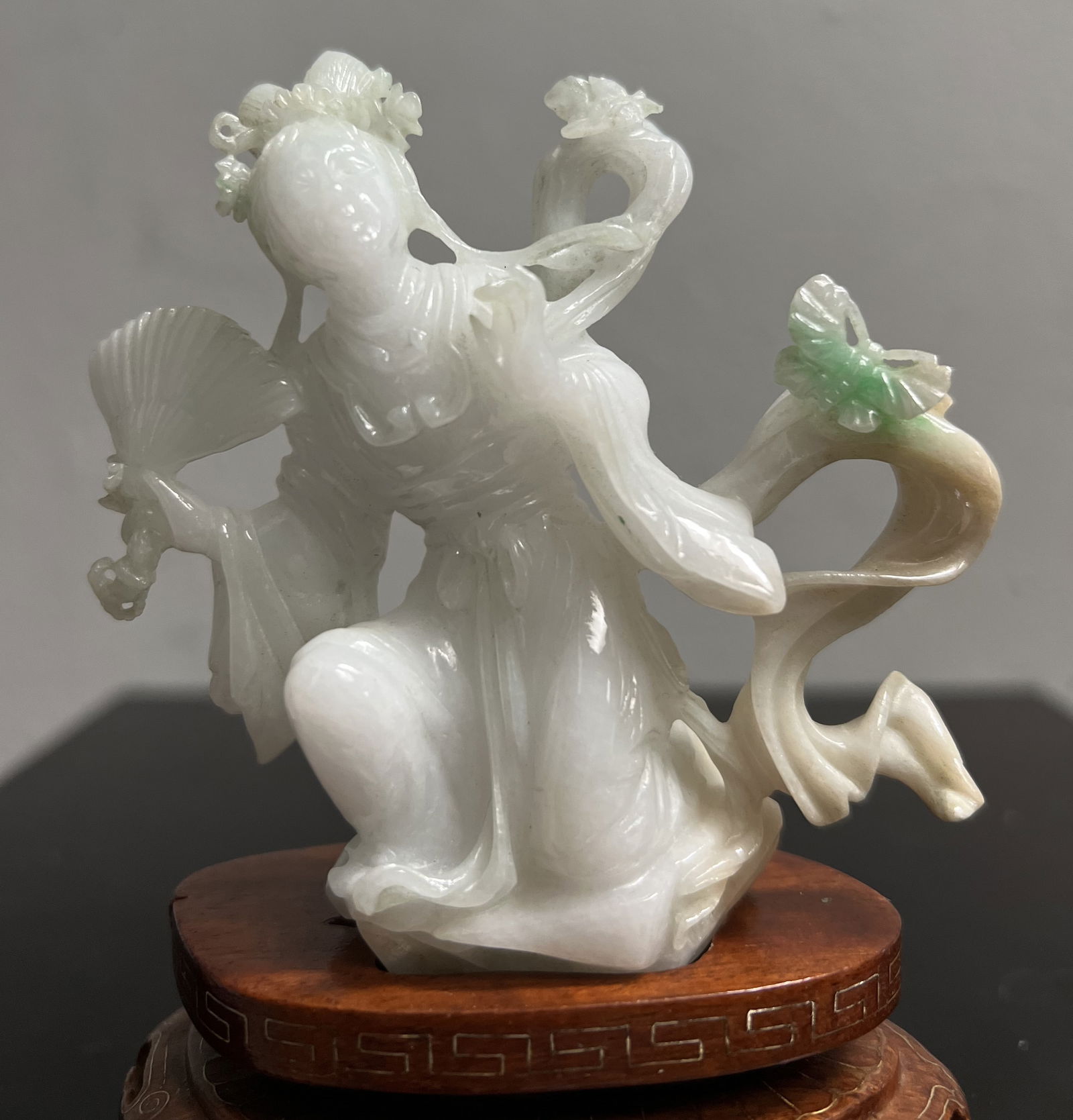Stunning Chinese Hand Carved White Jade Quan Yin with a Touch of Green on Wood Base: This exquisite Chinese figurine features a beautifully hand-carved white jade Quan Yin, with a touch of green on a wooden base. The intricate details of the bird animal type and the Kwan-yin and Buddh