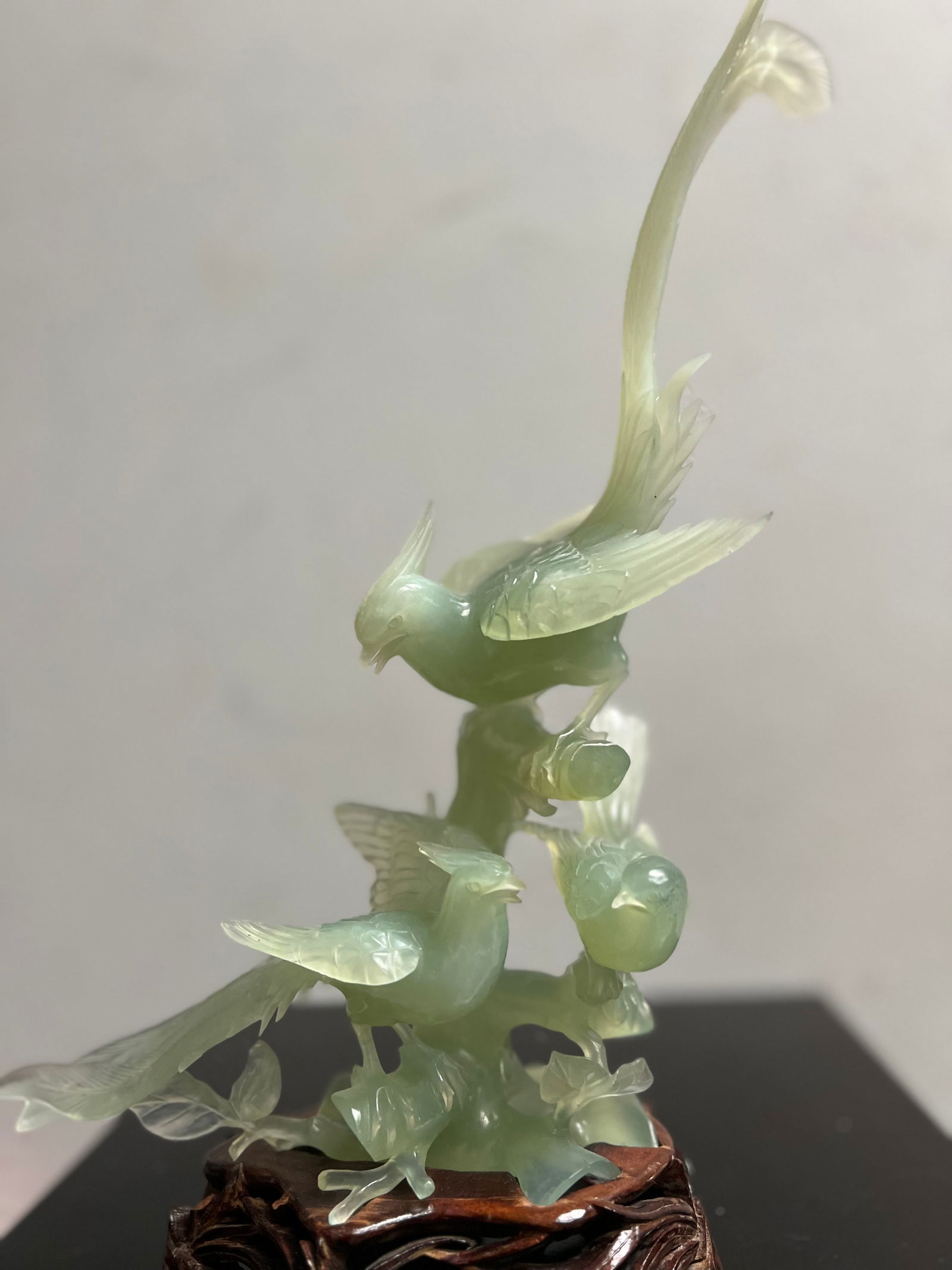 Stunning Chinese Hand Carved Green Jade Birds on a Branch on Wood Base: This exquisite figurine is a stunning example of Chinese artistry. The hand-carved green jade bird figurine is perched upon a branch, with intricate details that showcase the beauty of traditional Chi