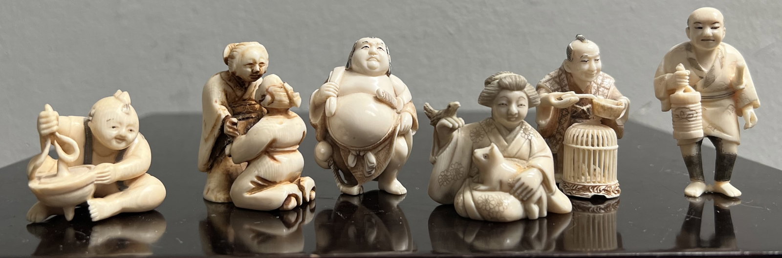 Stunning Collection of 6 Early 20C Chinese Small Hand Carved Figurines: This stunning collection of six early 20th century Chinese small hand-carved figurines is a must-have for any antique collector. Crafted from bone with exquisite attention to detail, these ivory figur