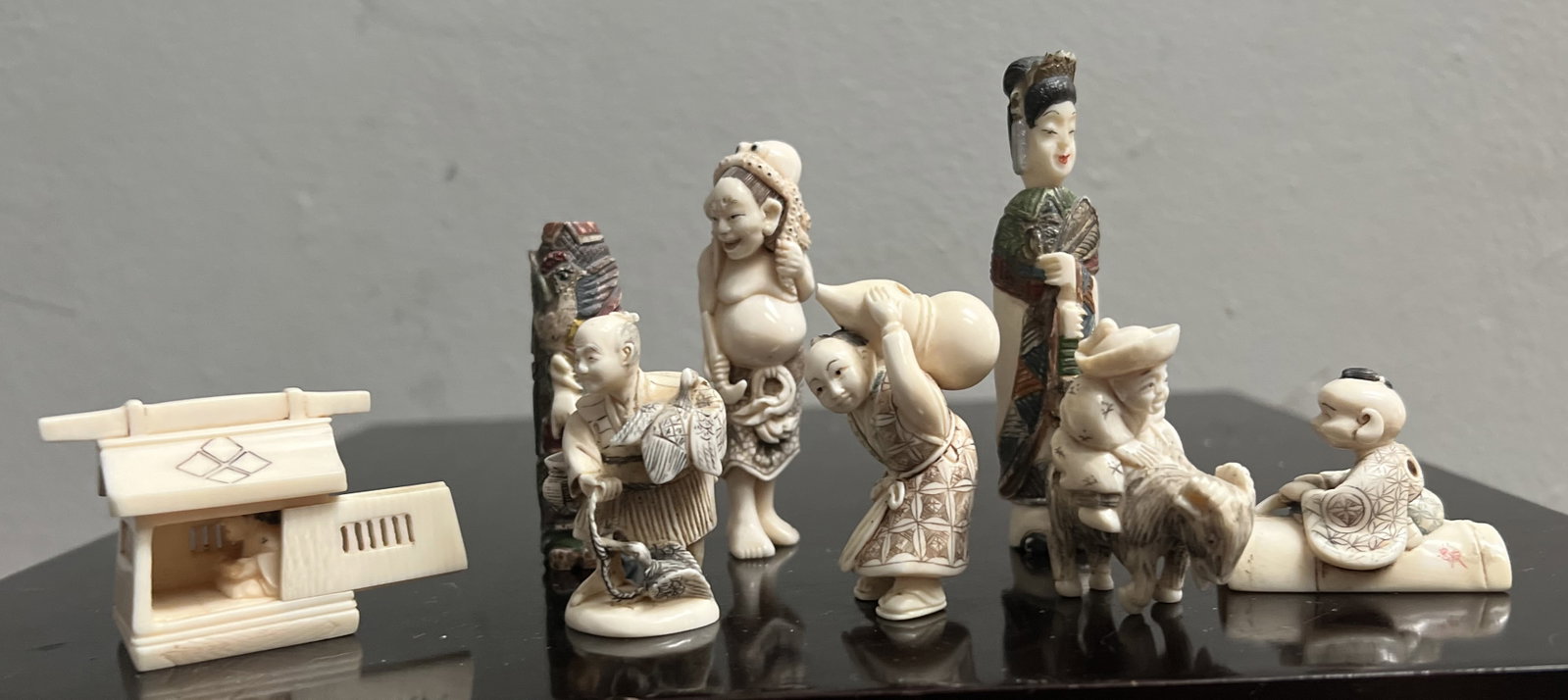 Stunning Collection of 8 Early 20C Chinese Small Hand Carved Figurines: This stunning collection of eight early 20th century Chinese small hand-carved figurines is a must-have for any antique enthusiast. Crafted from bone with great attention to detail, these figurines ar