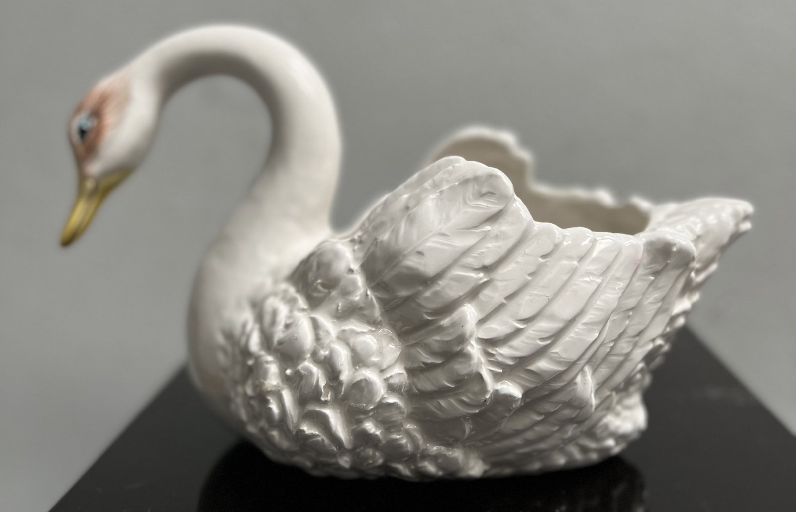 Bassano Ceramic Swan Centerpiece Fruit Bowl Made in Italy Stamped: Add a touch of elegance to your dining table with this beautiful Bassano ceramic swan centerpiece fruit bowl. Made in Italy, this original piece is stamped with the brand's signature. The swan's white